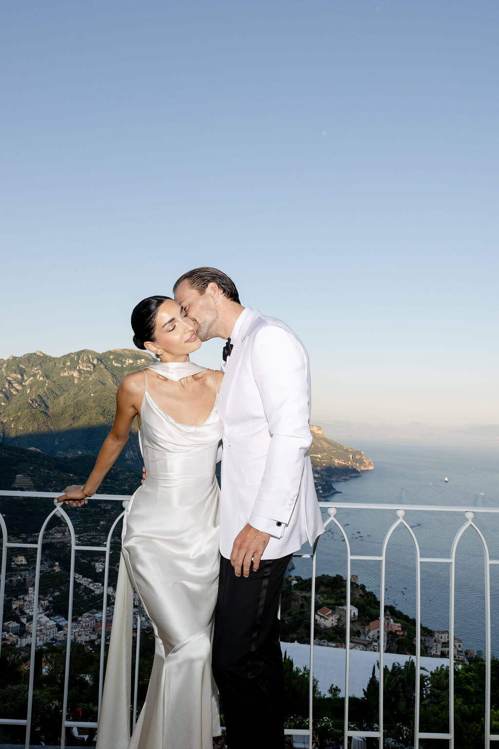 Couple in Positano smiling in front of ocean view